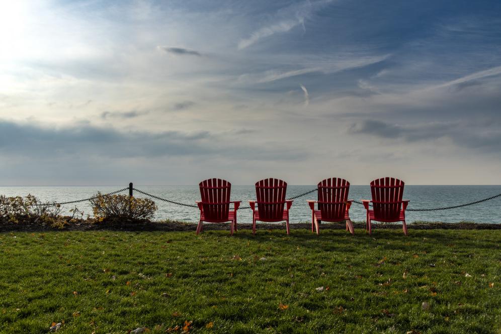 Red chairs along Lake Michigan